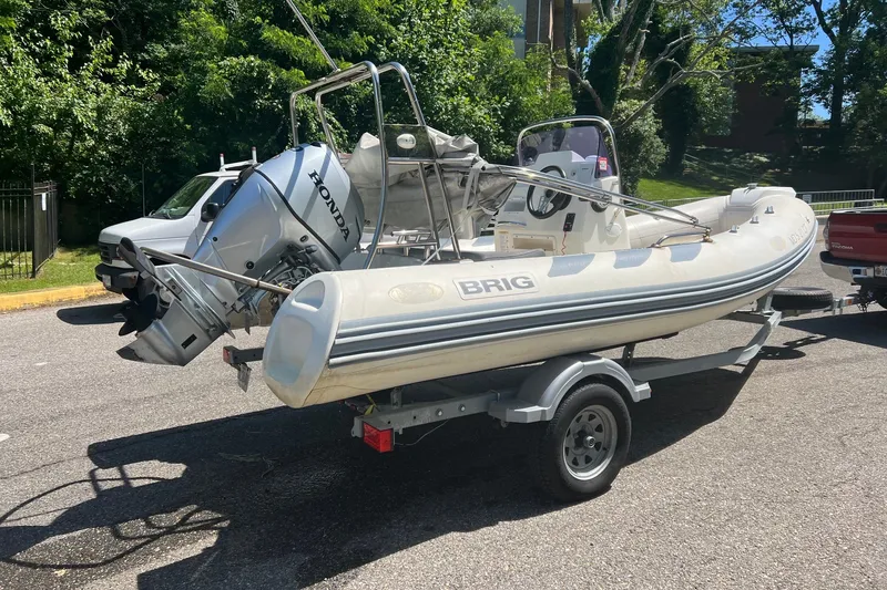 Slide: The Image of 2019 Brig Navigator 485 inflatable boat on trailer with Honda outboard motor. - 21