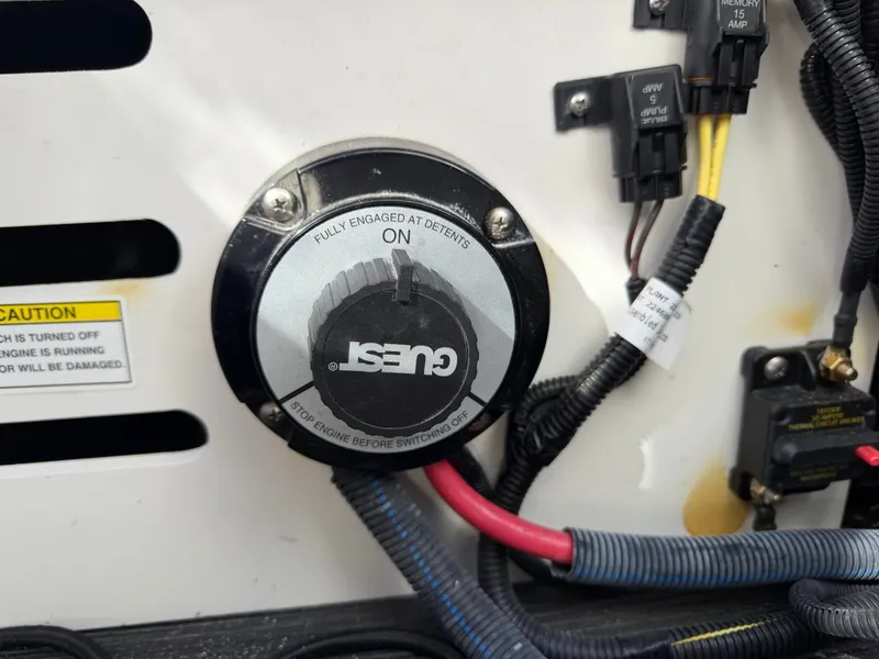 Slide: The Image of Close-up of a boat battery switch with cables and labels. - 13