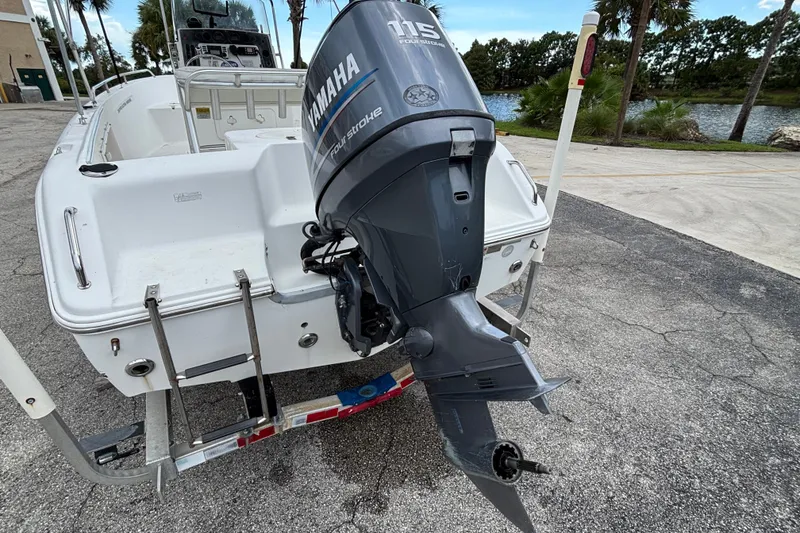 Slide: The Image of 2006 Sea Hunt Triton 186 boat with Yamaha 115 outboard motor on trailer. - 1