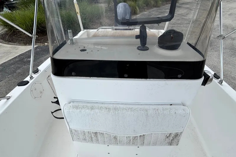Slide: The Image of 2006 Sea Hunt Triton 186 boat console with windshield and steering wheel. - 8