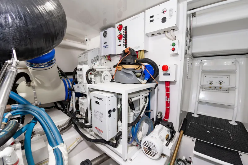 Slide: The Image of The engine room of a 2018 Viking Sport Tower with various technical equipment and cables. - 46