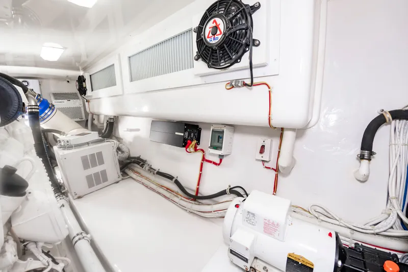 Slide: The Image of The engine room of a 2018 Viking Sport Tower with cables, ventilation, and technical equipment. - 48
