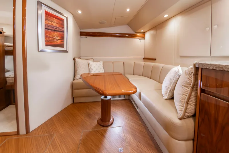 Slide: The Image of Interior of the 2018 Viking Sport Tower with elegant seating area and wooden table. - 29