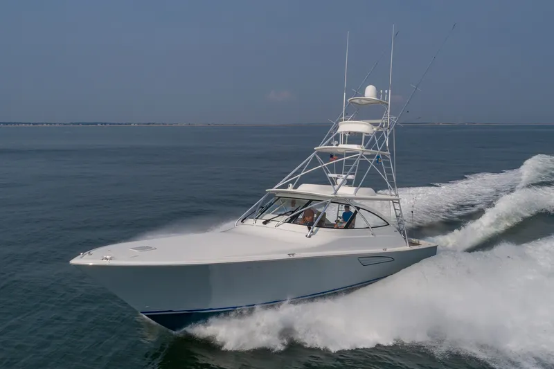 The Image of 2018 Viking Sport Tower on the water, featuring a distinctive tower and sleek white design. - 0