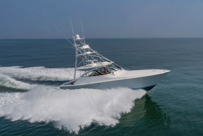 Slide: The Image of A 2018 Viking Sport Tower speeds across the sea, creating an impressive wake. - 5