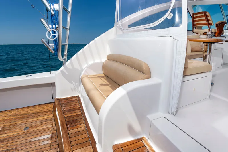 Slide: The Image of The 2018 Viking Sport Tower features a sleek cockpit with wooden flooring and comfortable seating. - 11