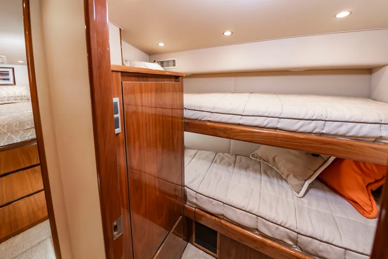 Slide: The Image of Interior with bunk beds and wooden furnishings in a 2018 Viking Sport Tower. - 33