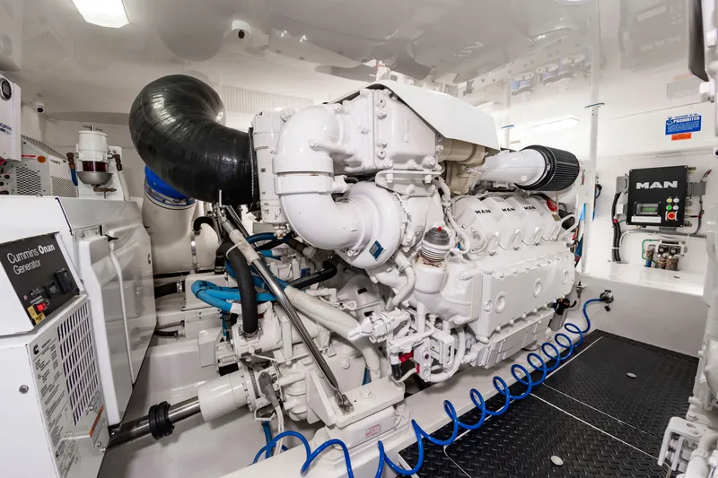 Slide: The Image of The engine room of a 2018 Viking Sport Tower with a large white engine and various equipment. - 44