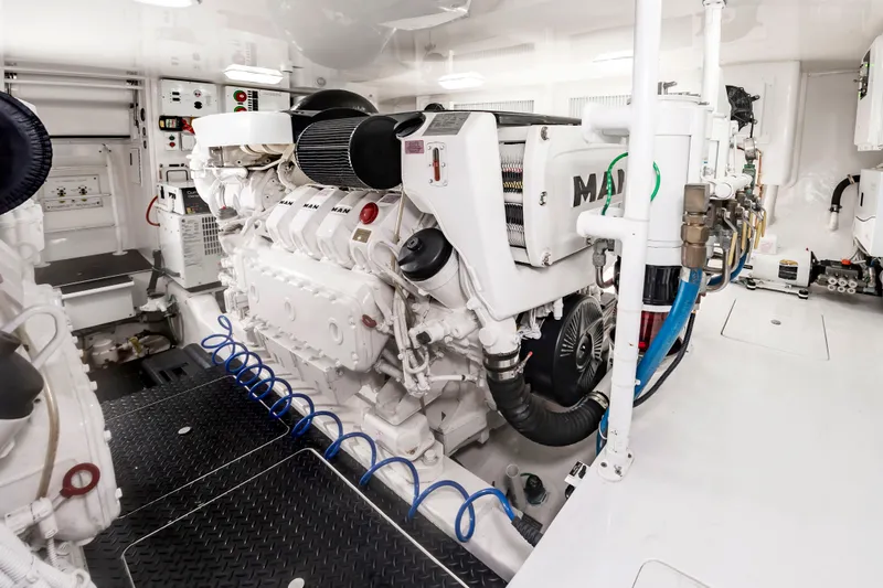 Slide: The Image of The engine room of a 2018 Viking Sport Tower with a large white engine and clean setup. - 42
