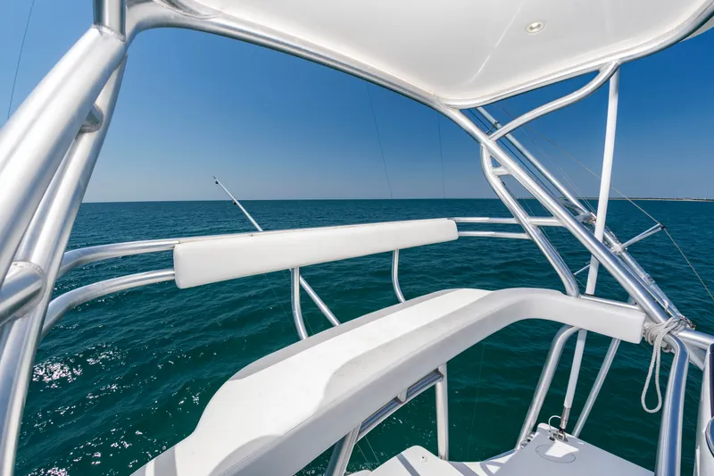 Slide: The Image of View from an elevated helm station on a boat with blue sea in the background. - 24