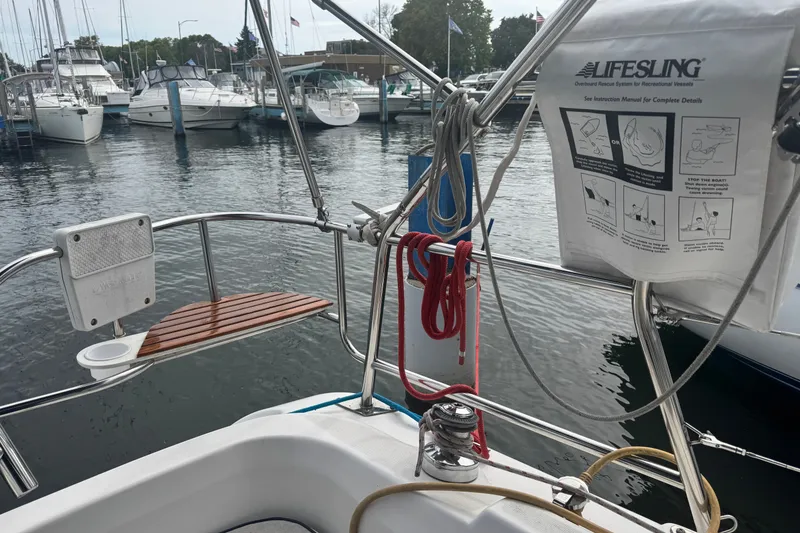Slide: The Image of Hunter 31 sailboat cockpit with Lifesling rescue system, docked at marina, 2006 model. - 16