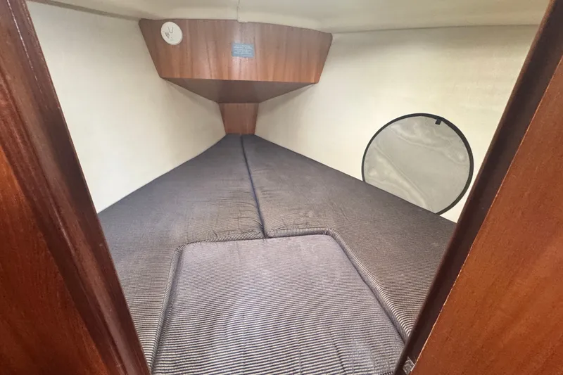 Slide: The Image of Interior cabin of a 2006 Hunter 31 sailboat with cozy bedding. - 30