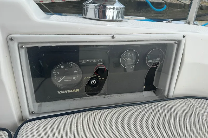 Slide: The Image of Control panel of a 2006 Hunter 31 sailboat featuring Yanmar engine gauges. - 17