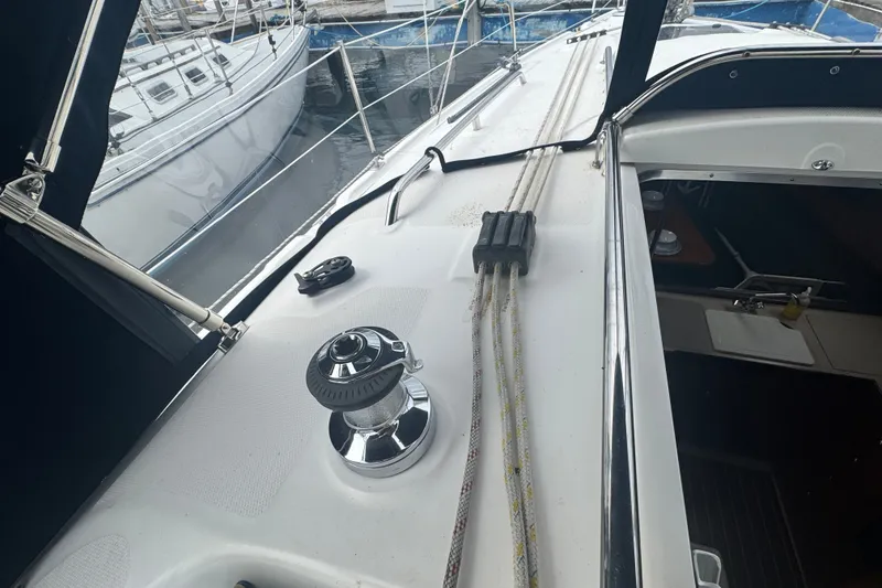 Slide: The Image of 2006 Hunter 31 sailboat deck with winch and rigging, docked at marina. - 8