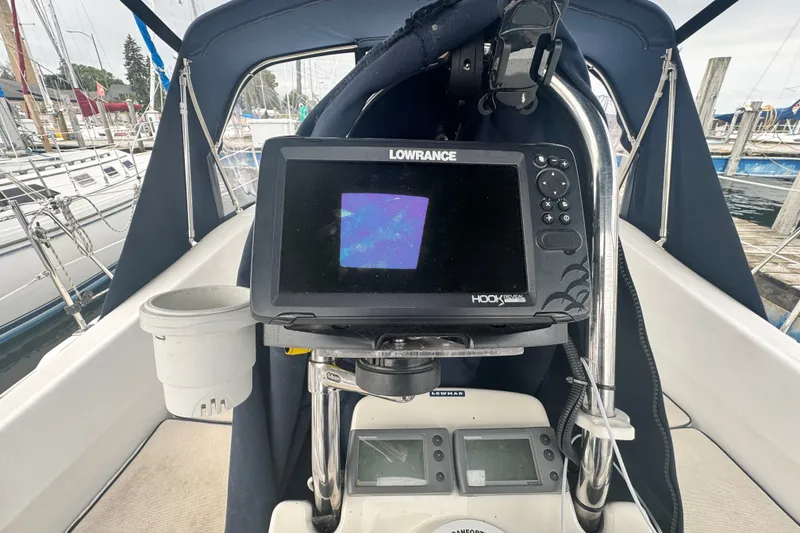 Slide: The Image of Cockpit of 2006 Hunter 31 sailboat with Lowrance navigation system. - 12