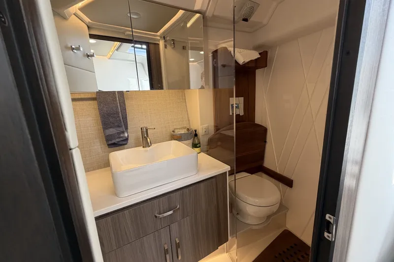 Slide: The Image of Luxurious bathroom in 2022 Regal 36 Grande Coupe yacht with modern fixtures. - 31