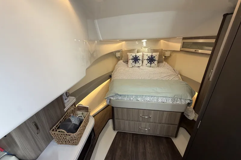 Slide: The Image of Luxurious cabin interior of 2022 Regal 36 Grande Coupe yacht with cozy bedding. - 25