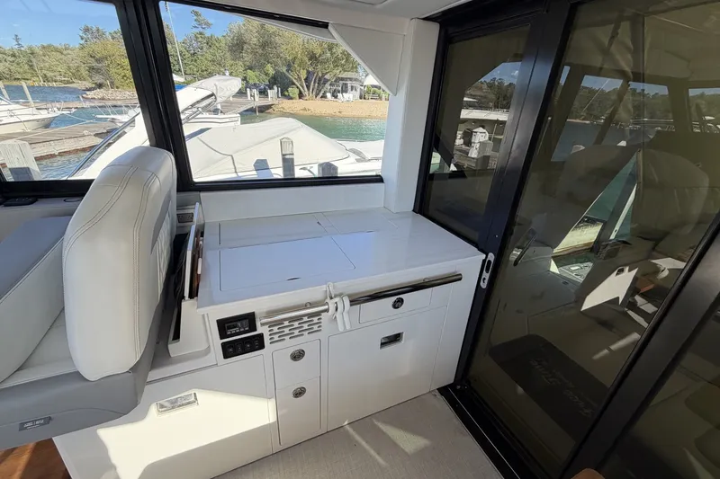 Slide: The Image of Interior of 2022 Regal 36 Grande Coupe yacht with sleek seating and modern design. - 18