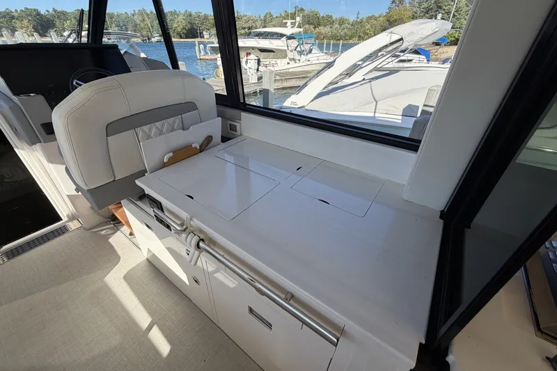 Slide: The Image of Interior of 2022 Regal 36 Grande Coupe yacht with sleek seating and modern amenities. - 17