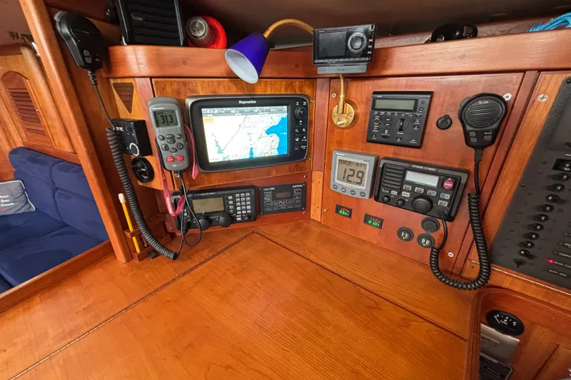 Slide: The Image of Navigation equipment on a 2002 Sabre 402 sailboat, featuring GPS and communication devices. - 38