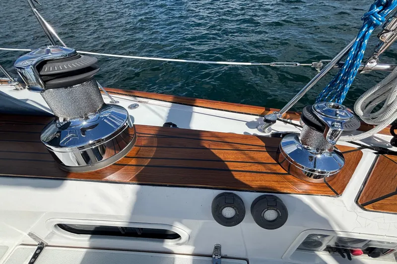 Slide: The Image of Deck of 2002 Sabre 402 sailboat with polished winches and wooden finish. - 20