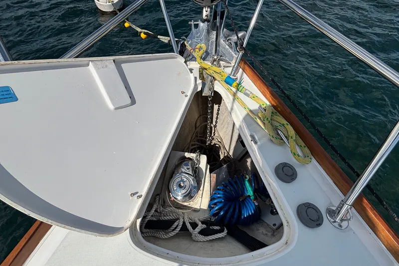 Slide: The Image of Open anchor locker on 2002 Sabre 402 sailboat with ropes and equipment visible. - 31