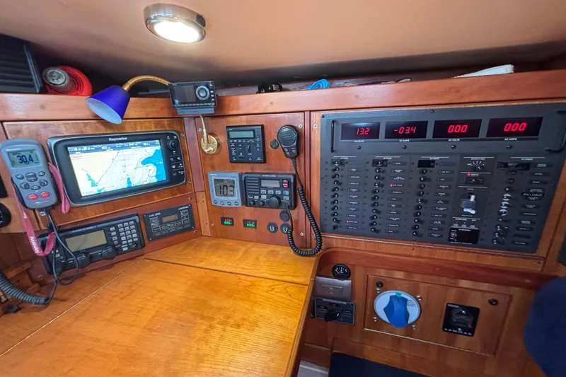 Slide: The Image of Navigation and control panel inside a 2002 Sabre 402 yacht. - 43