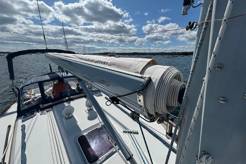 Slide: The Image of Sailing yacht Sabre 402, 2002 model, with rolled sail on a sunny day. - 28