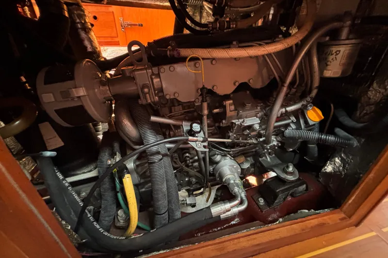 Slide: The Image of Engine compartment of a 2002 Sabre 402 sailboat, showcasing detailed mechanical components. - 78