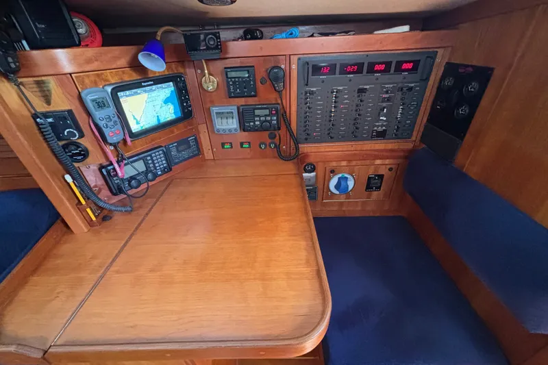 Slide: The Image of Navigation station of a 2002 Sabre 402 yacht with electronic equipment and control panels. - 36