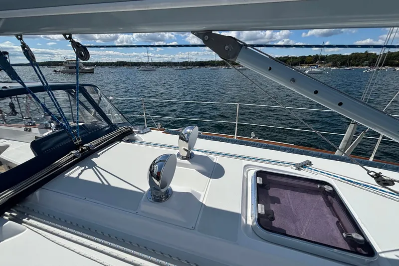 Slide: The Image of Deck view of 2002 Sabre 402 sailboat on a sunny day, overlooking calm waters. - 29