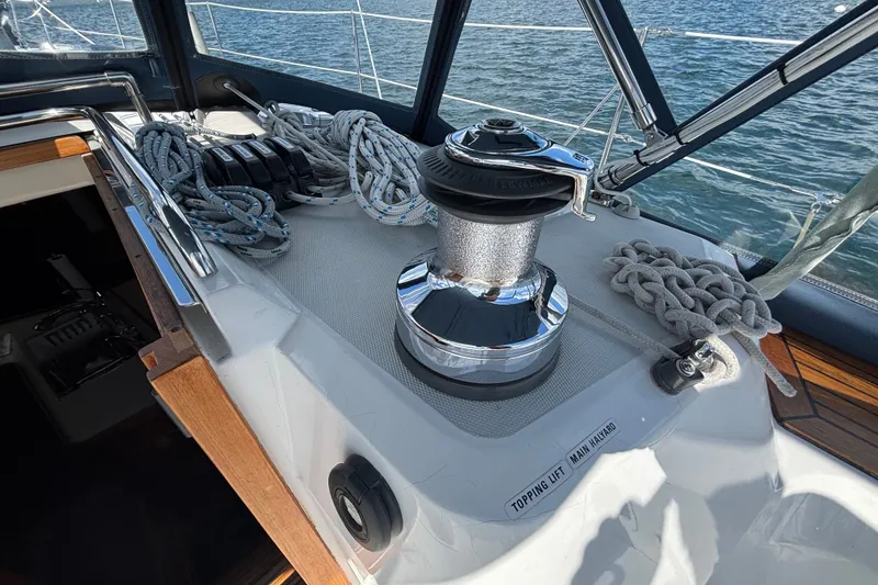 Slide: The Image of Sailboat deck of 2002 Sabre 402 with winch, ropes, and ocean view. - 22