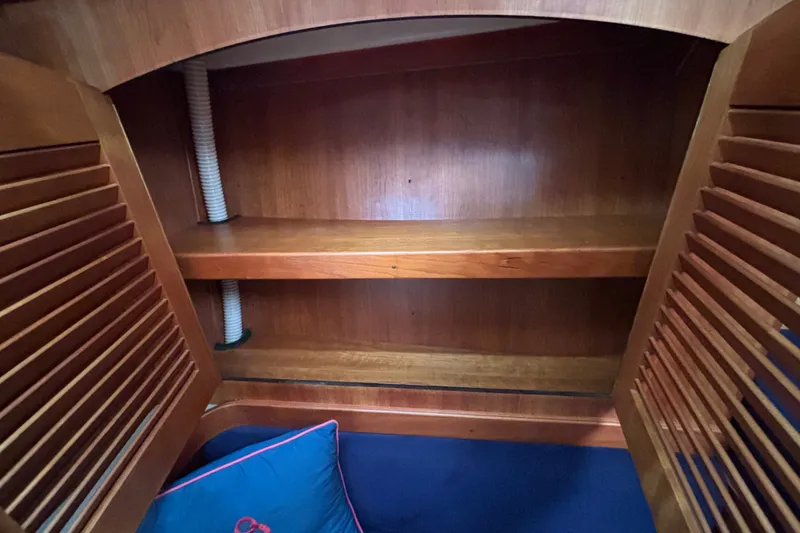 Slide: The Image of Wooden interior shelving in a 2002 Sabre 402 sailboat cabin. - 53