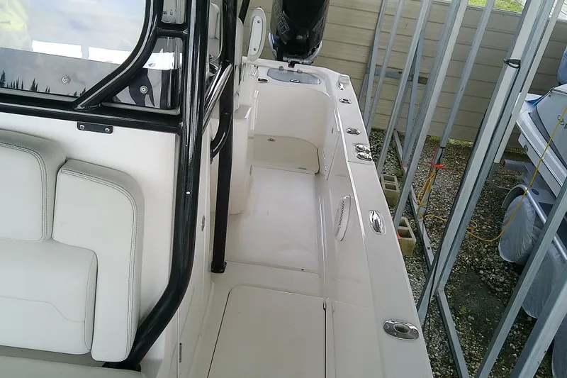 Slide: The Image of Interior view of a 2022 Sea Cat 260 boat, showcasing seating and deck details. - 41