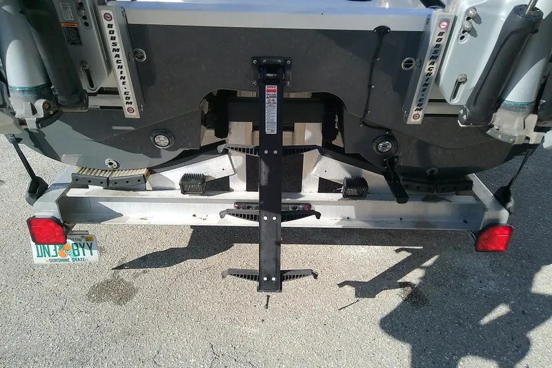 Slide: The Image of Rear view of a 2022 Sea Cat 260 boat on a trailer with Florida license plate. - 18
