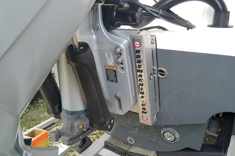 Slide: The Image of Close-up of a 2022 Sea Cat 260 boat engine mount with hydraulic components. - 20