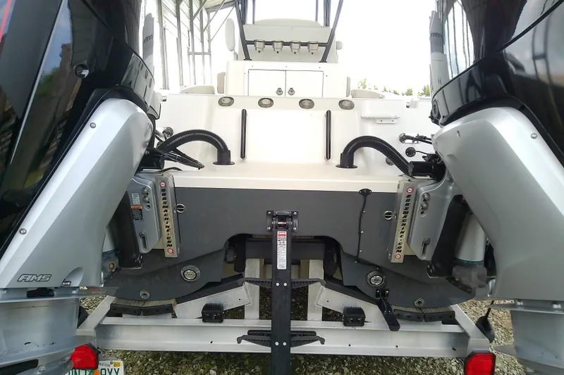 Slide: The Image of 2022 Sea Cat 260 boat with dual outboard motors, rear view. - 22