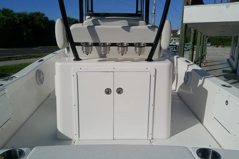 Slide: The Image of 2022 Sea Cat 260 boat interior with rod holders and storage compartments. - 14