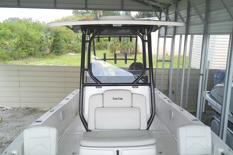 Slide: The Image of The image shows a 2022 Sea Cat 260 boat in a covered area. - 34
