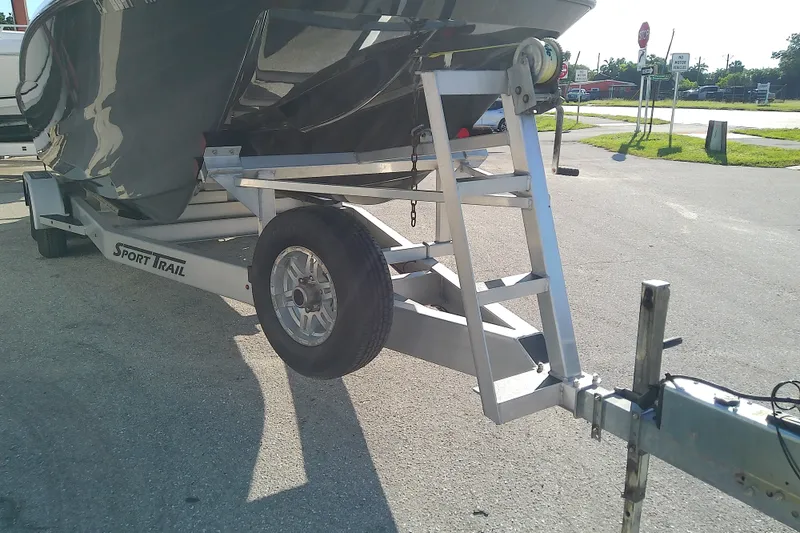 Slide: The Image of Trailer carrying a 2022 Sea Cat 260 boat, parked on a sunny day. - 10