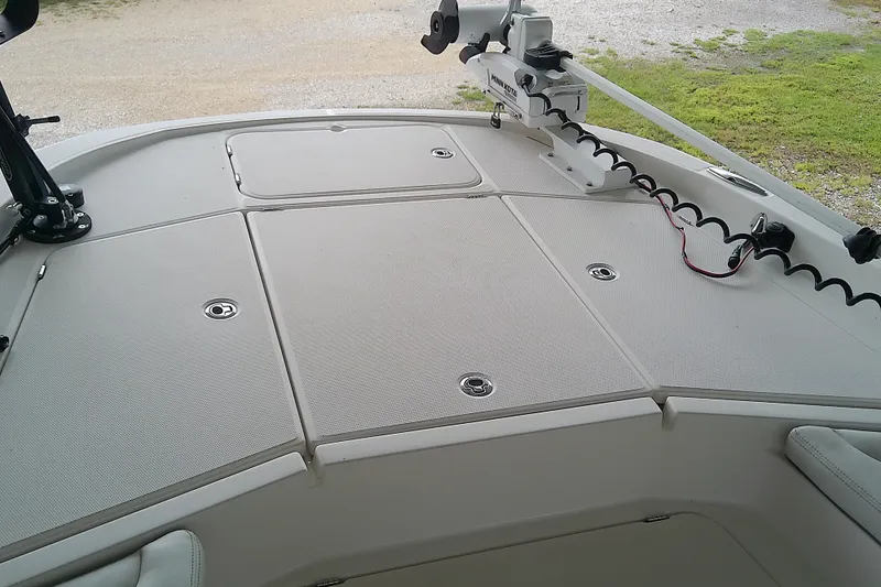 Slide: The Image of Deck of 2022 Sea Cat 260 boat with mounted equipment and storage compartments. - 36