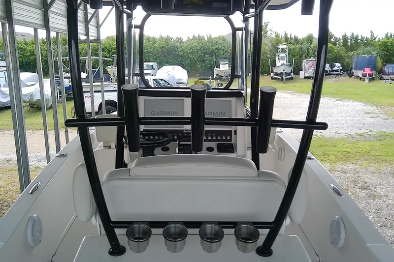 Slide: The Image of 2022 Sea Cat 260 boat interior with Garmin electronics and rod holders. - 53