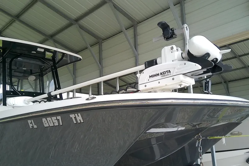 Slide: The Image of 2022 Sea Cat 260 boat with Minn Kota trolling motor in a covered dock. - 9