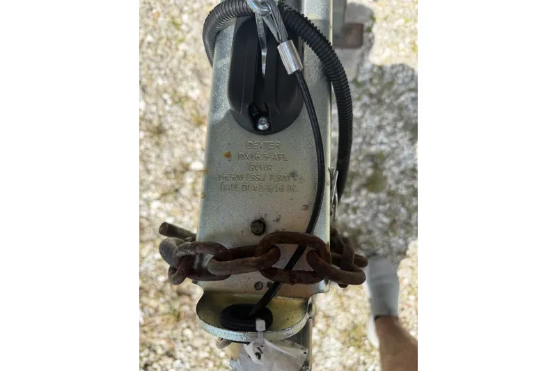 Slide: The Image of Trailer hitch with chain on a 2022 Sea Cat 260 boat. - 84