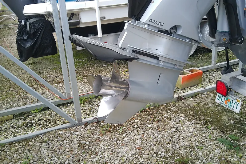 Slide: The Image of Outboard motor of a 2022 Sea Cat 260 boat on a trailer. - 17