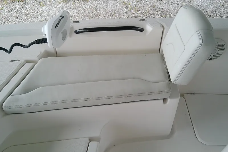 Slide: The Image of 2022 Sea Cat 260 boat interior with white cushioned seating and Minn Kota trolling motor. - 39