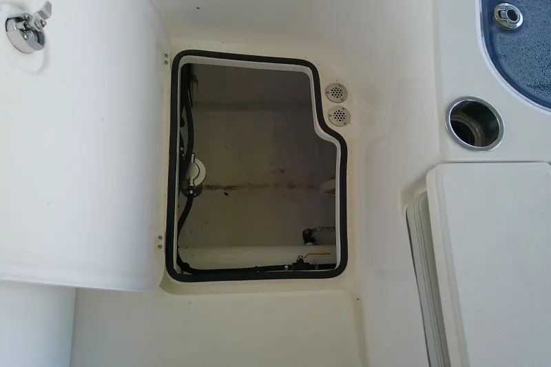 Slide: The Image of Open hatch on 2022 Sea Cat 260 boat, showing interior compartment details. - 75