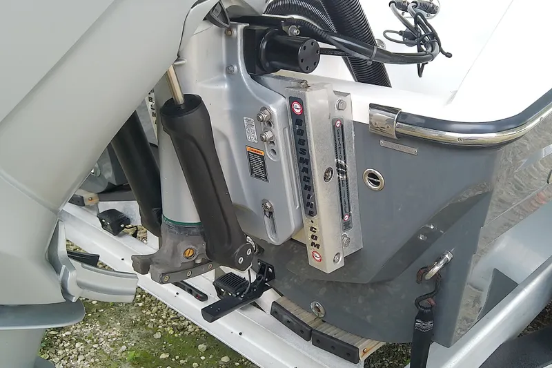 Slide: The Image of Outboard motor mount on 2022 Sea Cat 260 boat, featuring hydraulic components and sleek design. - 14
