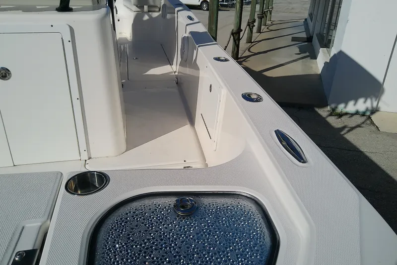 Slide: The Image of 2022 Sea Cat 260 boat interior with sleek white design and stainless steel fixtures. - 16