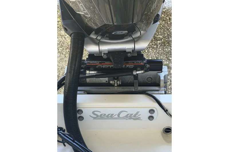 Slide: The Image of 2022 Sea Cat 260 boat engine detail with Optus system, showcasing brand logo. - 82